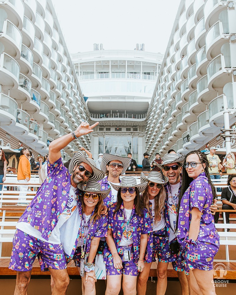 Group of Groove Cruise Captains in matching outfits after getting onboard the ship.