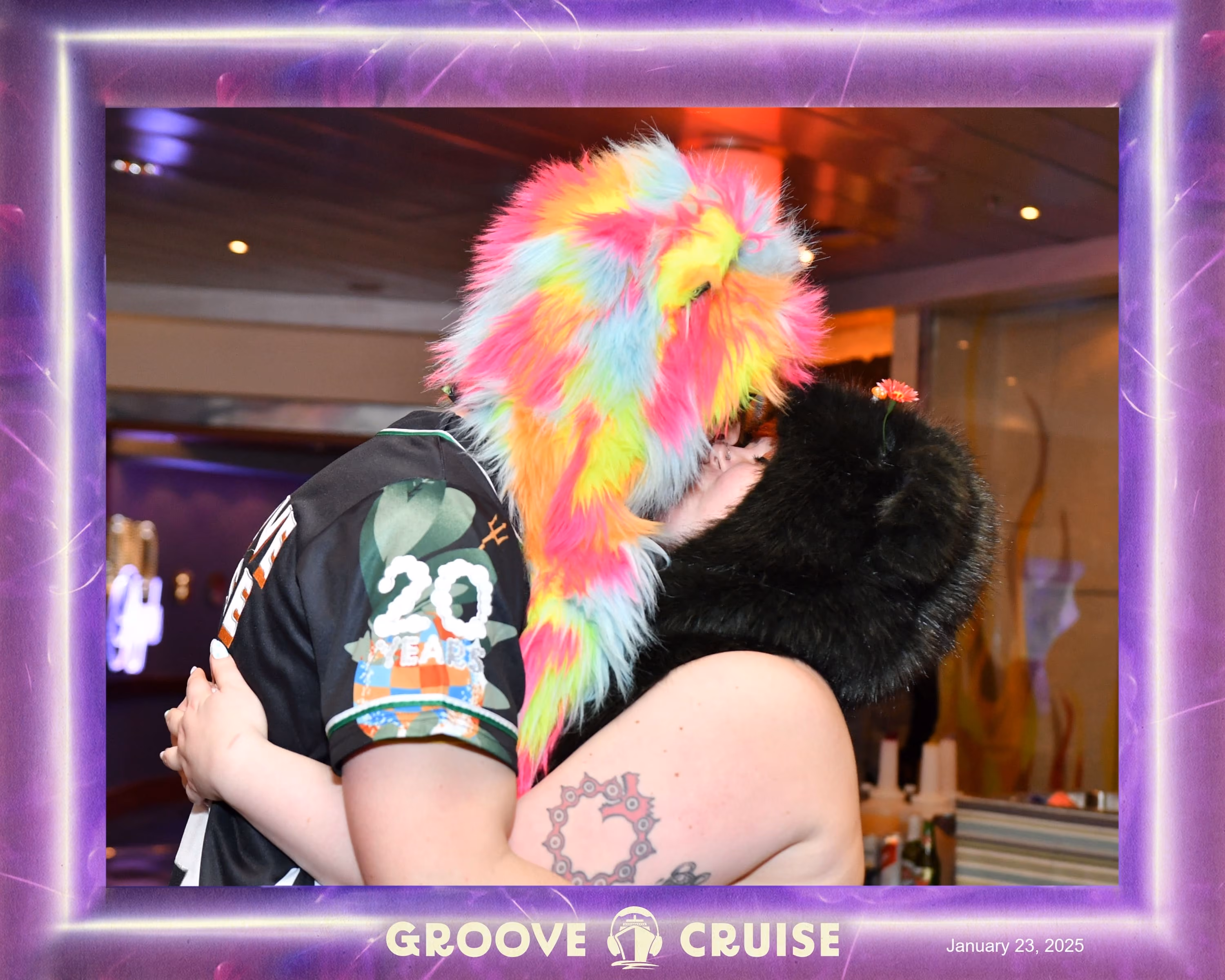 Julie and Branden sharing a kiss in the Groove Cruise 2025 photo frame.