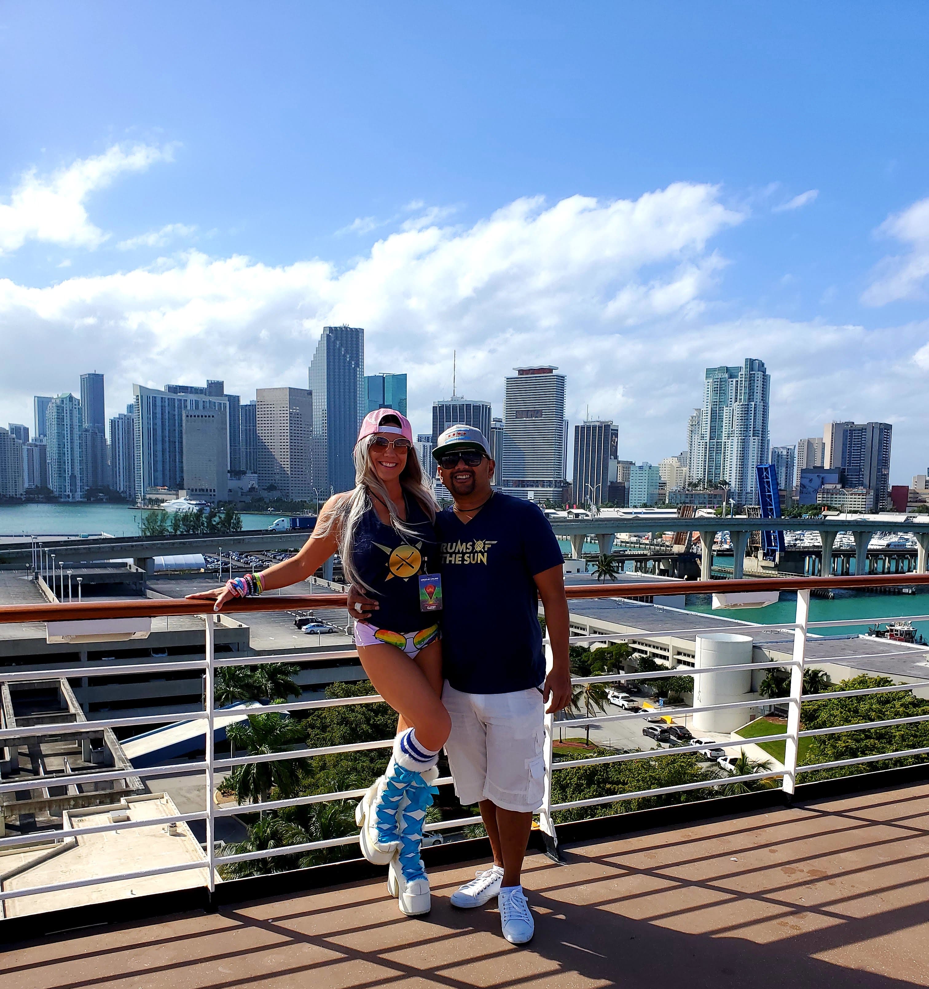  Bam Bam Buddha and Jenn posing in the sunshine on the pool deck on Groove Cruise in the Port of Miami.