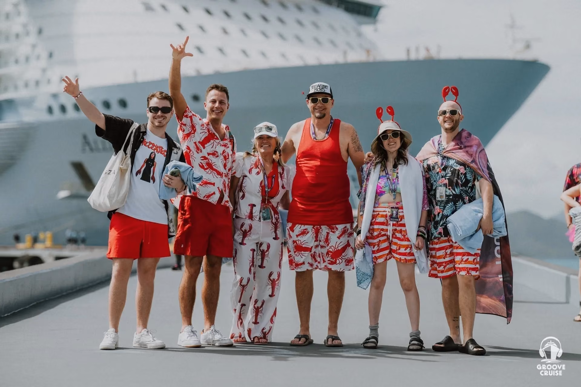 Groove Cruise ravers standing at port, wearing lobster themed rave costumes.