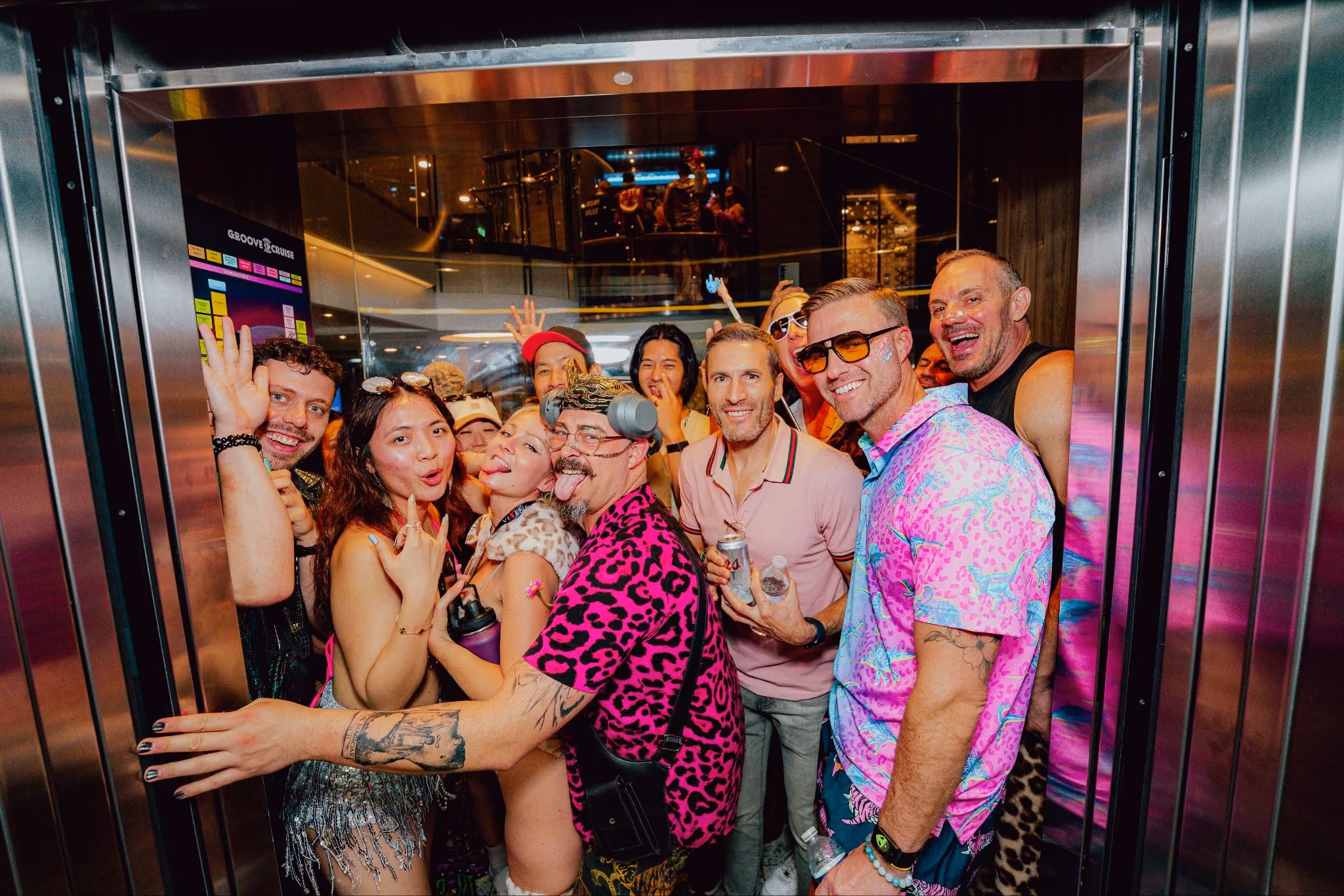 Cruise music festival attendees posing for a group photo in the elevator.