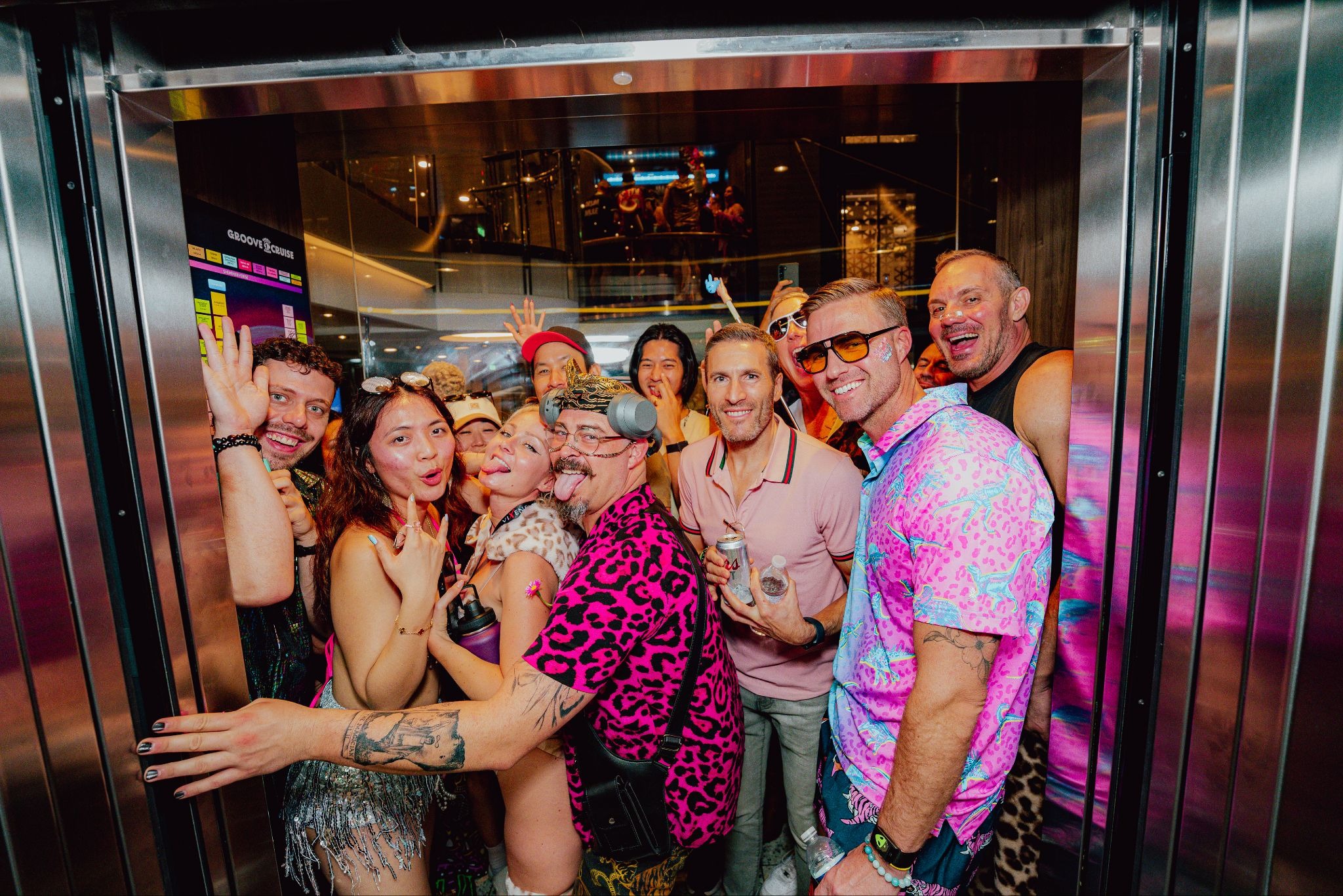 Cruise music festival attendees posing for a group photo in the elevator.