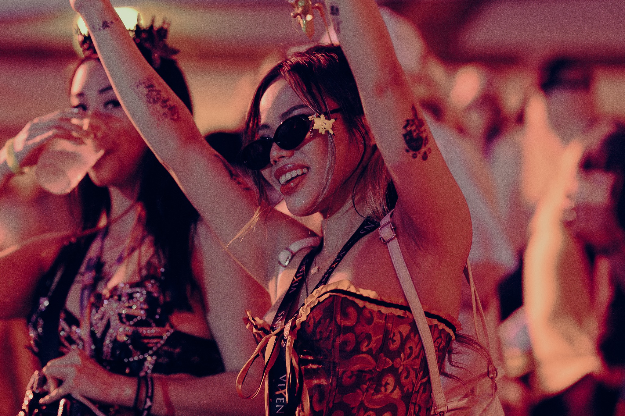 EDM festival goer dancing at a DJ set on Groove Cruise 2026.