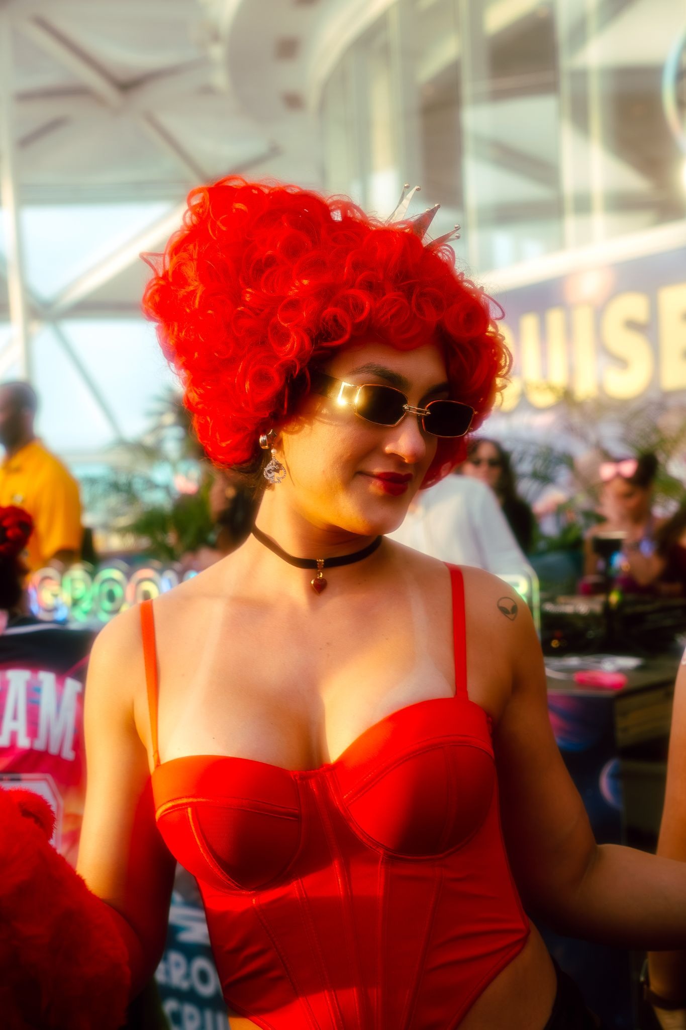 EDM festival attendee wearing red floral costume on Groove Cruise