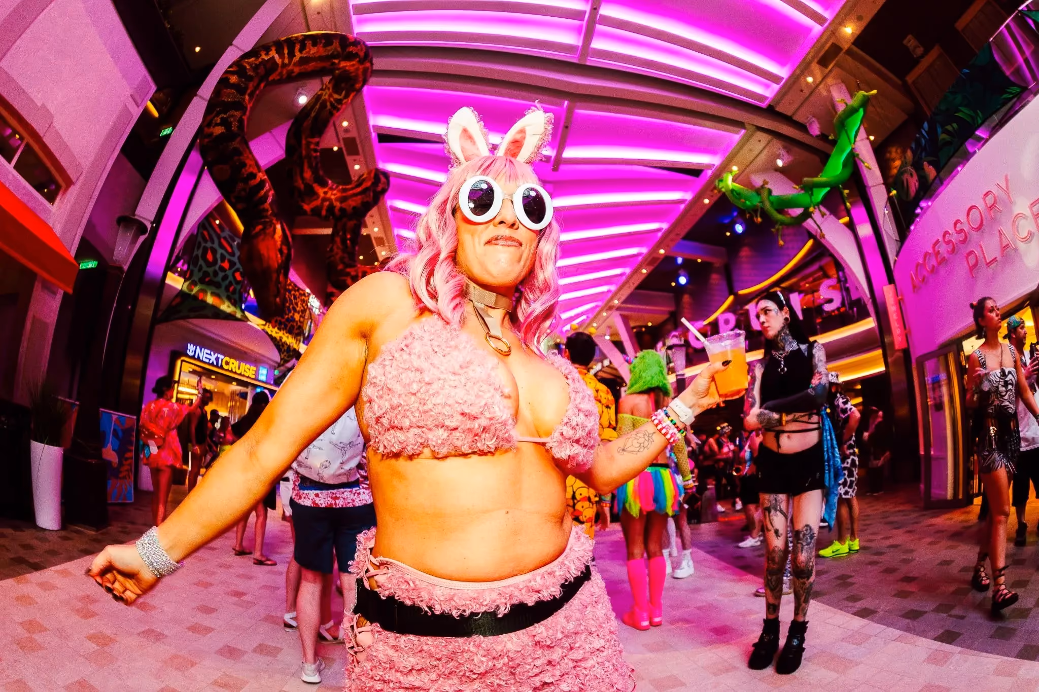 Woman wearing pink cartoon themed rave outfit EDM cruise