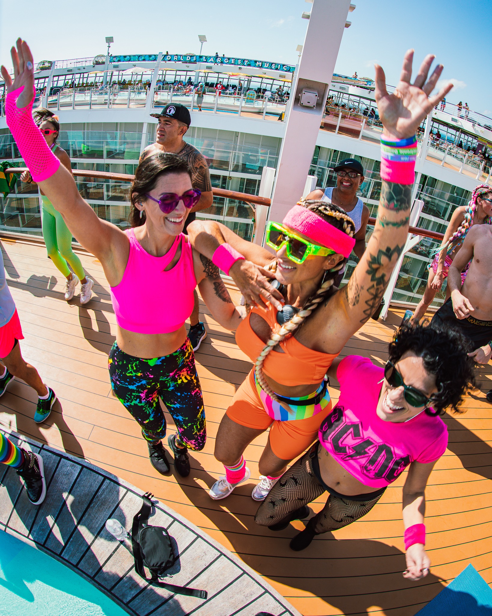 Miami EDM festival cruise attendees dressed in retro swimwear.