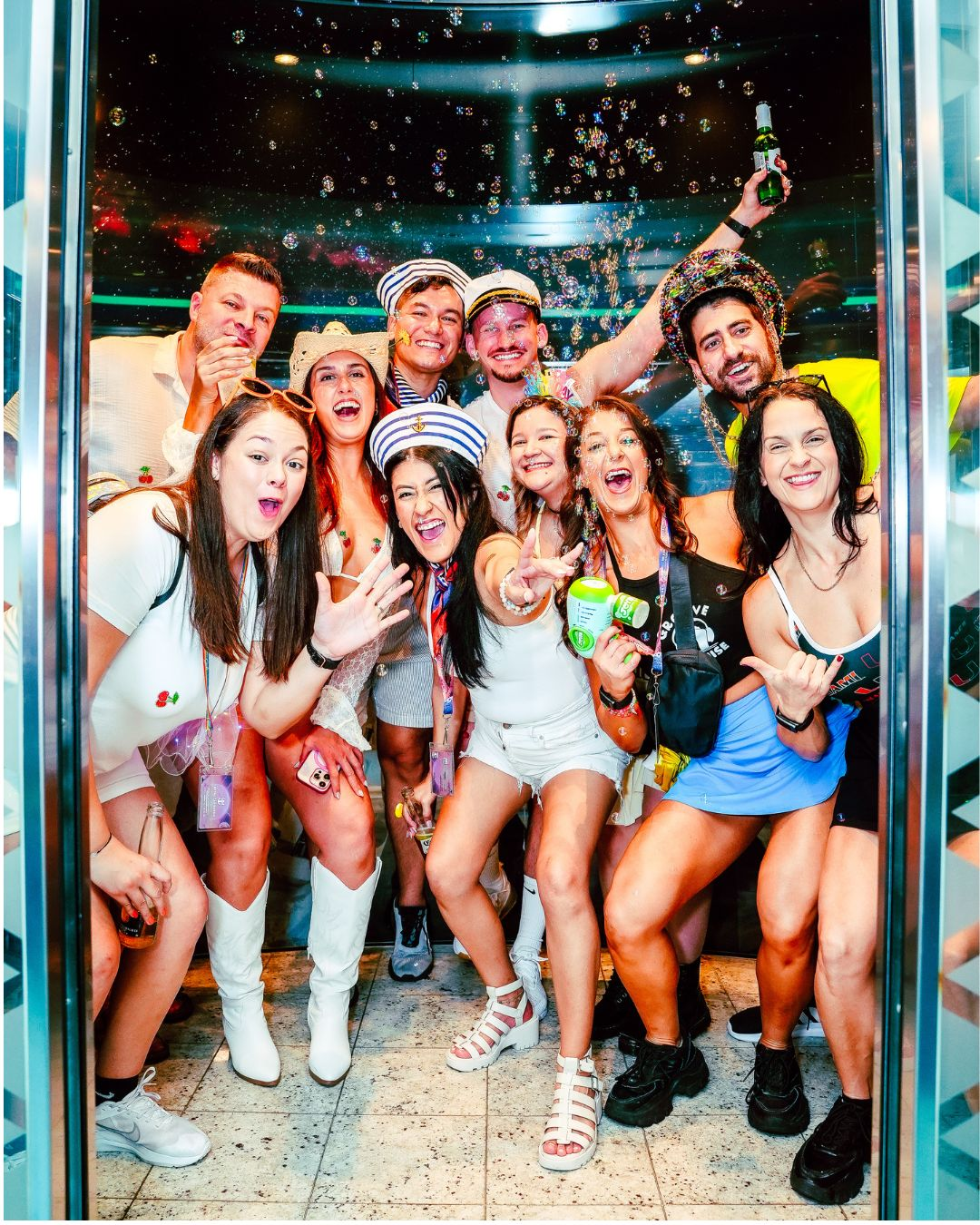 Group of friends smiling in an elevator on Miami music festival cruise