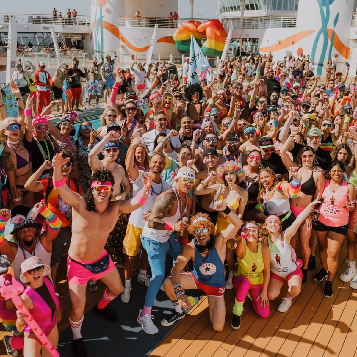 EDM cruise 2026 attendees dressed in neon themed rave fashion