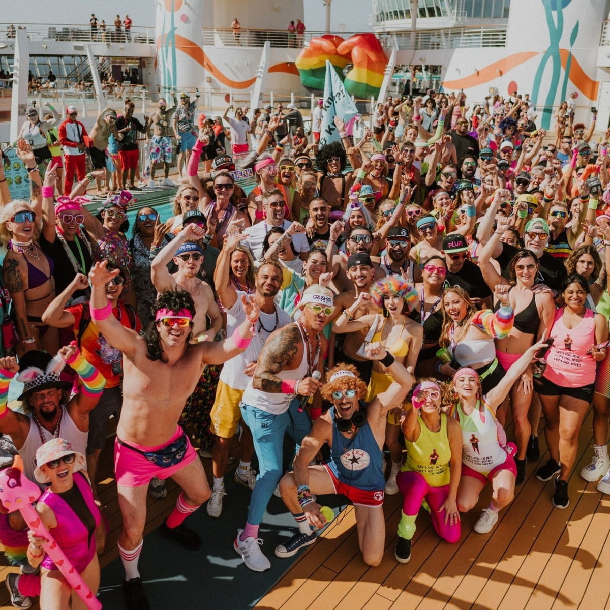  EDM cruise 2026 attendees dressed in neon themed rave fashion