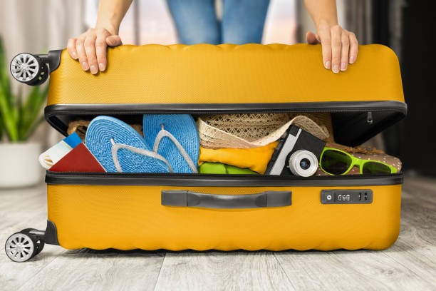 Music festival goer packing for Miami EDM cruise