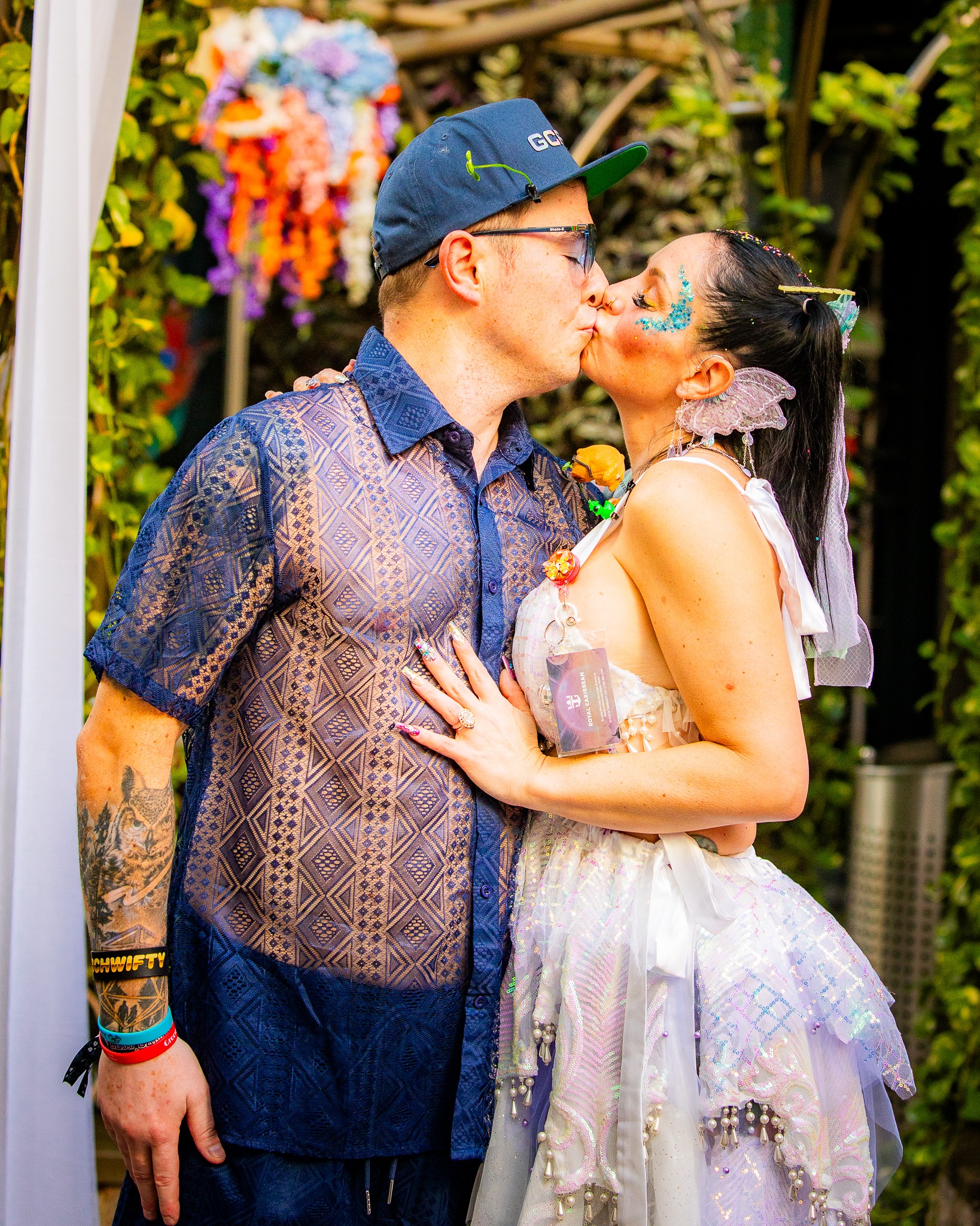 Couple kissing while celebrating their wedding anniversary on a rave cruise