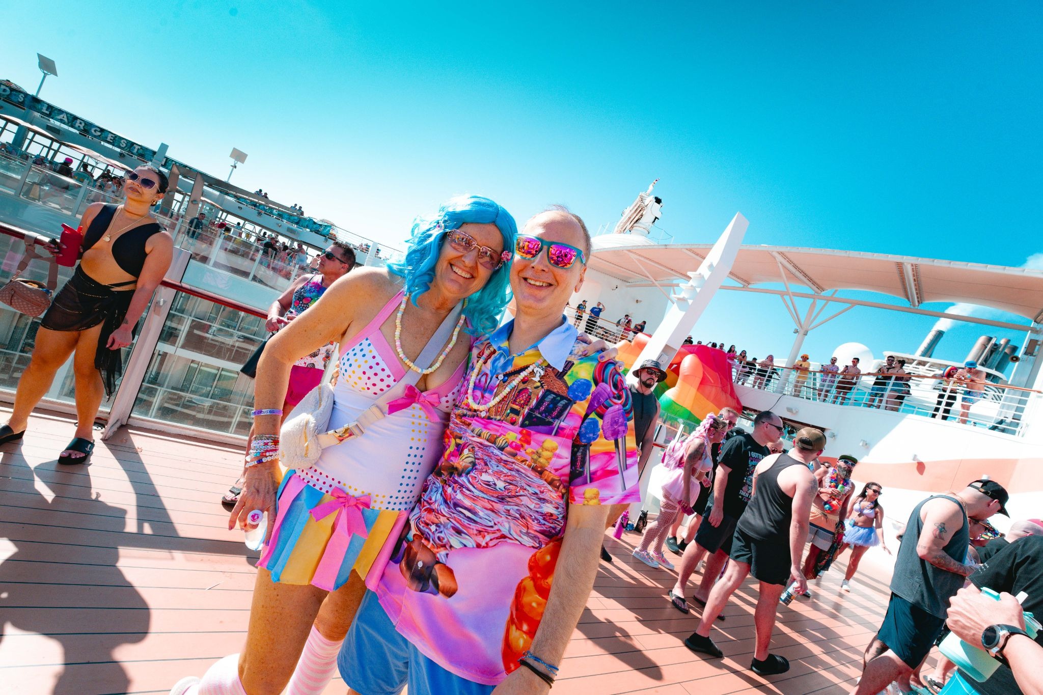 Couple celebrating an anniversary together in themed costumes aboard Groove Cruise