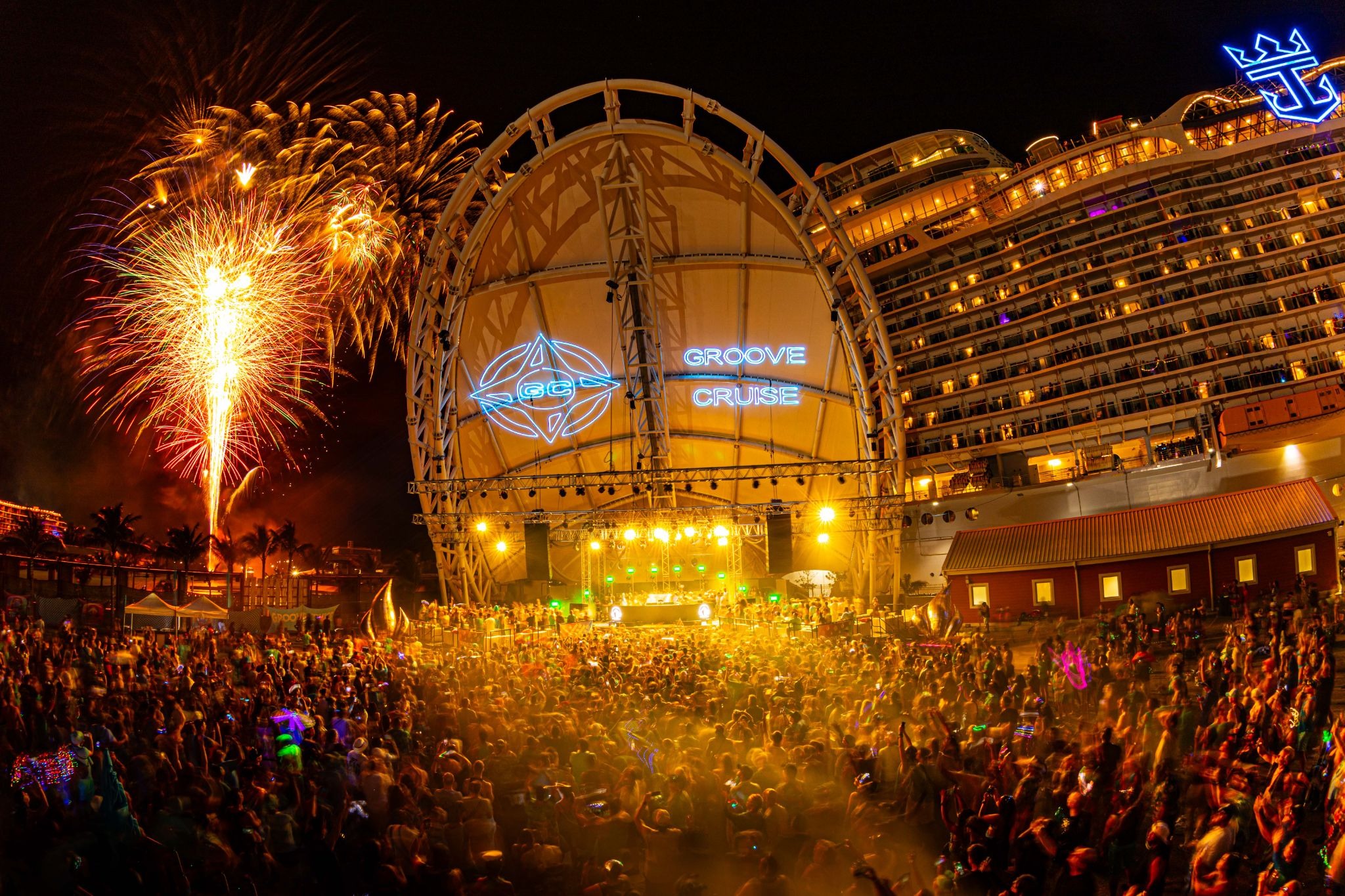 Groove Cruise 2026 destination party with a large crowd and fireworks