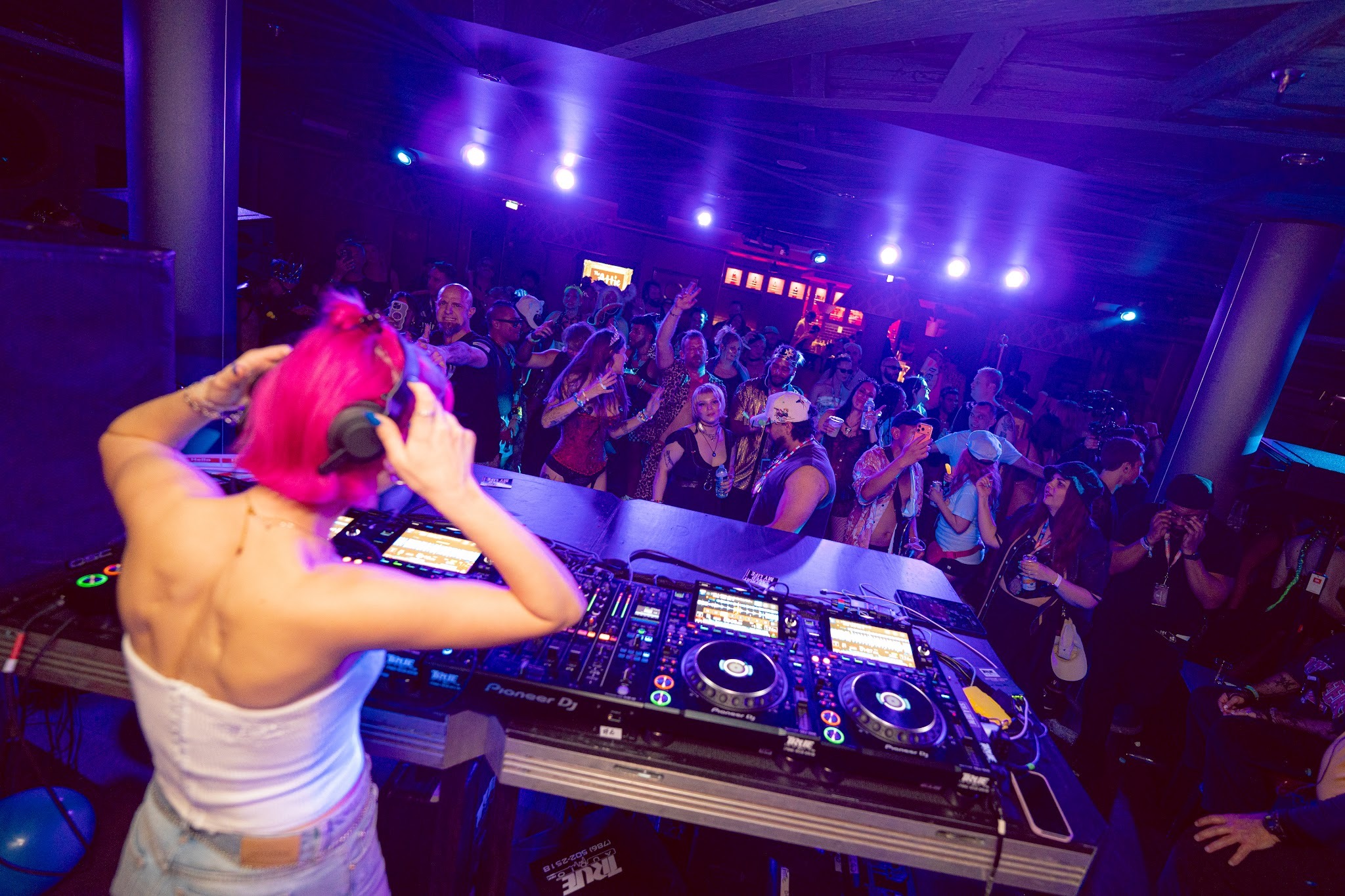 Blossom playing a packed out Drum and Bass DJ set on a music festival cruise.