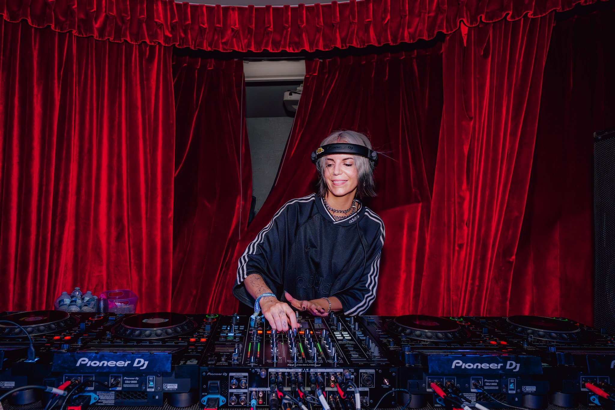 Alley Kay mixing drum and bass during her set on a Miami EDC cruise.