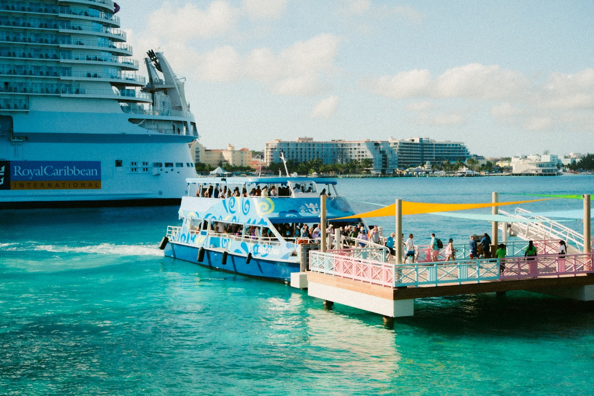 Ferry docked at the pier on Paradise Island in the Bahamas, providing transportation to Royal Beach Club for Groove Cruise 2027 Destination Day.