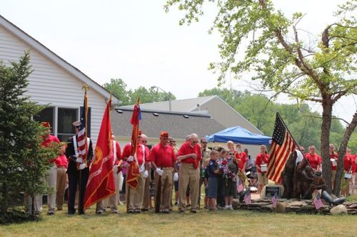 Farm land with a red barn in the distance