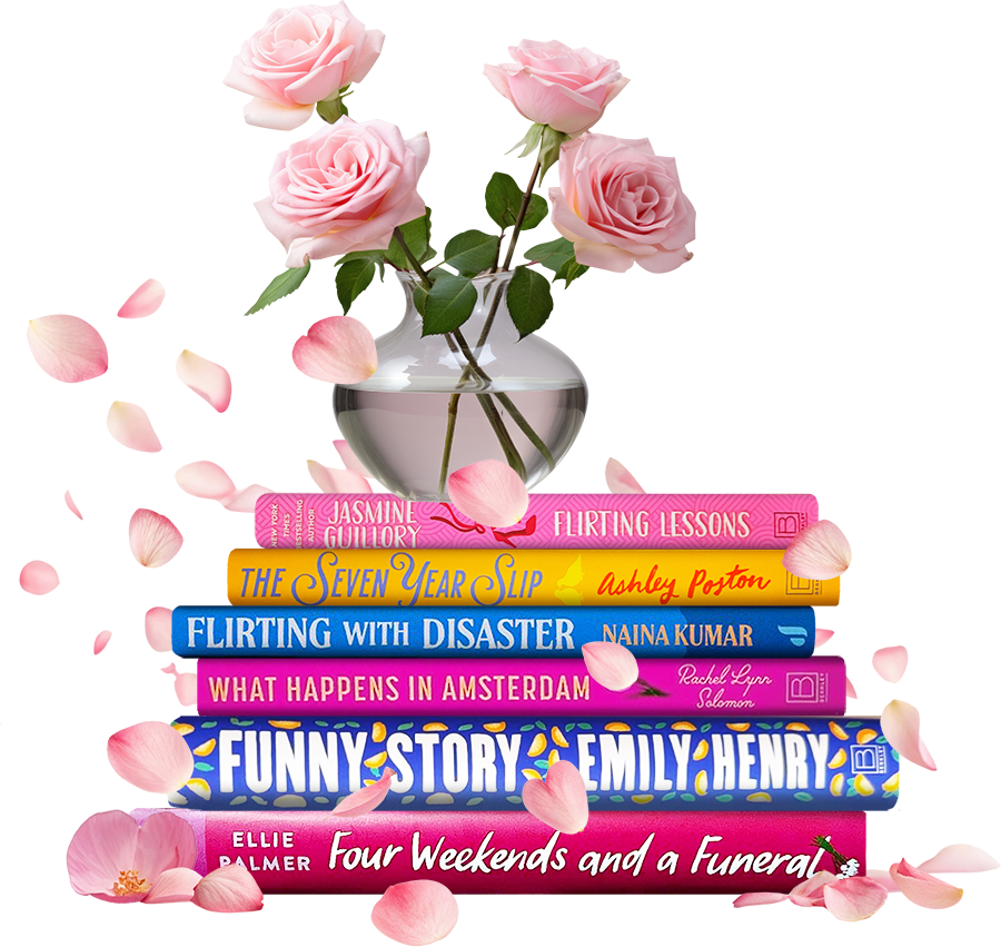 A stack of romance books with a vase of pink roses on top. pink rose petals float around the books