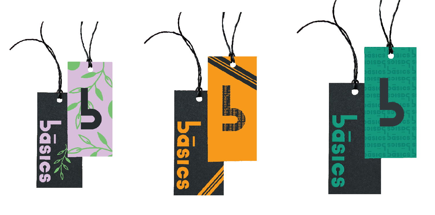 Mockups of clothing tags with the initial Basics Inc. design on them