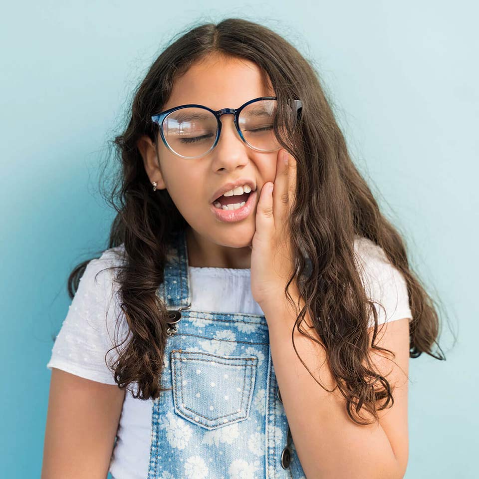 Child experiencing tooth discomfort