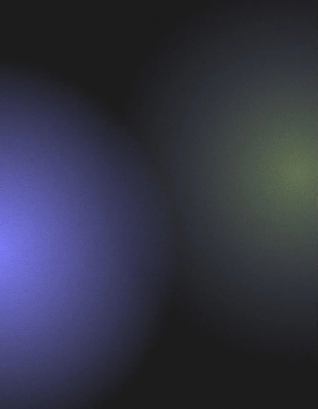 Abstract background with two blurred light spots, one purple on the left and one green on the right, on a dark backdrop.