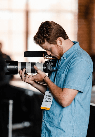 Man filming with camera