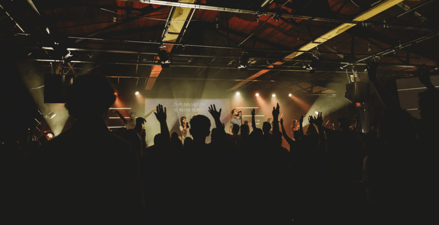 Crowd worshiping in church