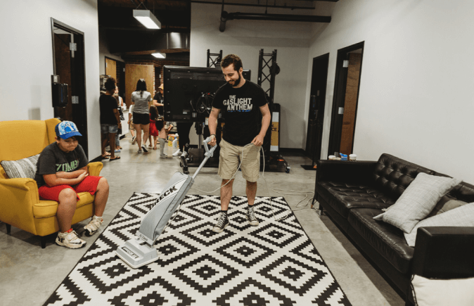 Man vacuuming the carpet