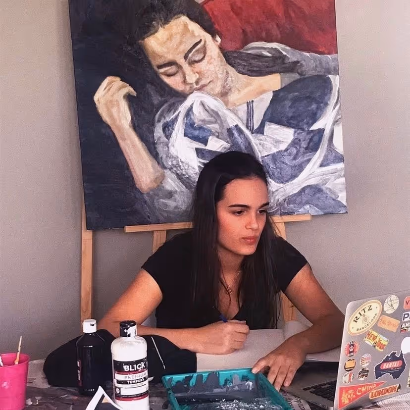Valentina V. is surrounded by her art as she concentrates on projects during the Prima Materia online classes.