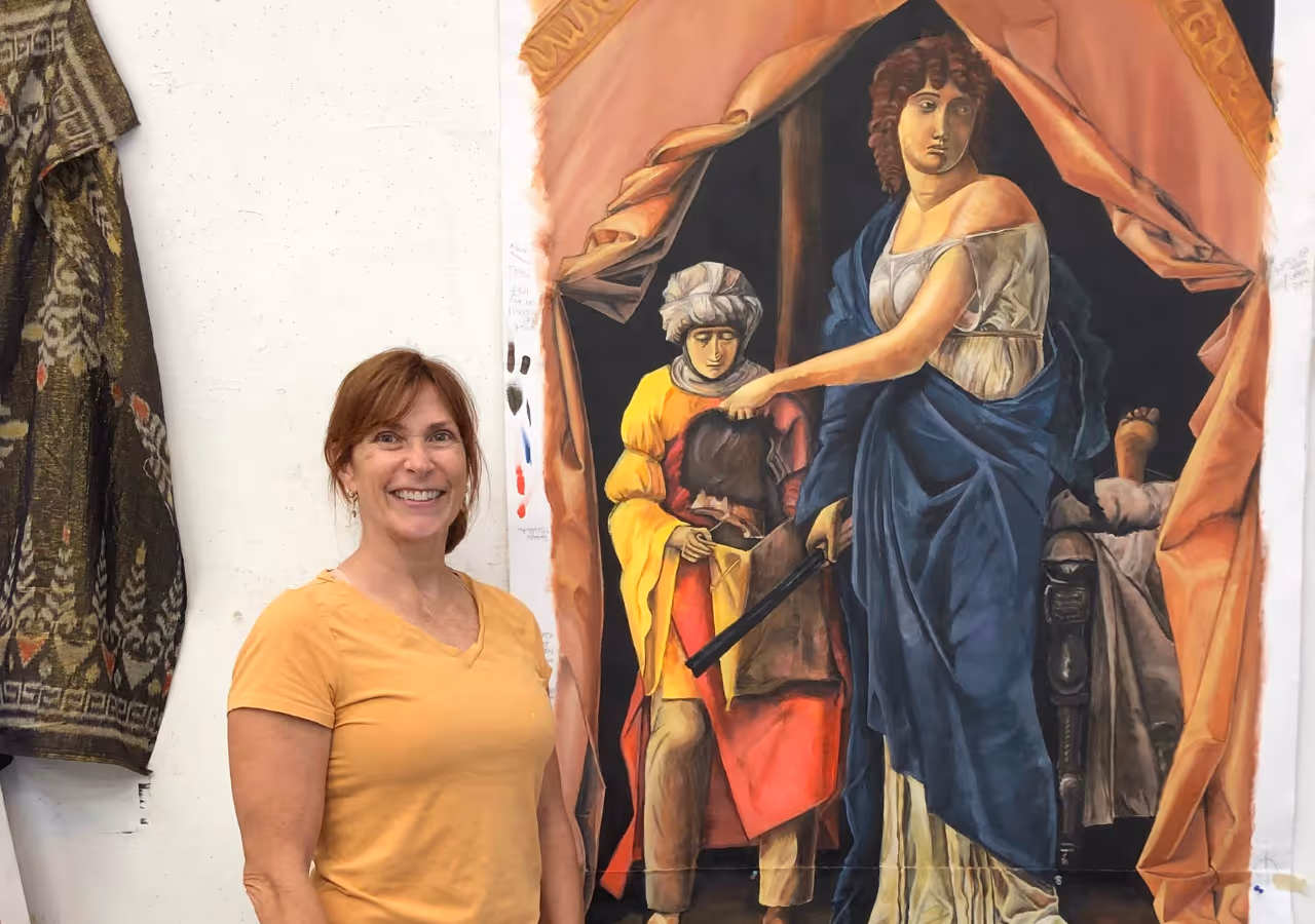 A woman standing next to her large scale painting that she created with Olya Losina in a 3-month long project about copying paintings by the Old Masters.