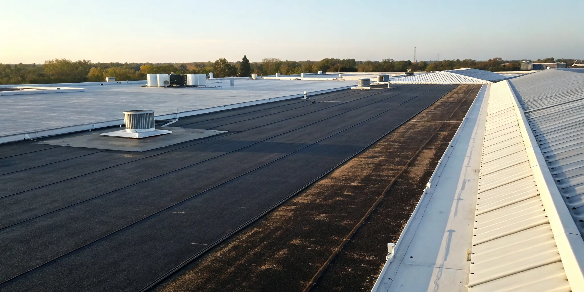 A reflective commercial cool roof meeting modern energy efficiency requirements.