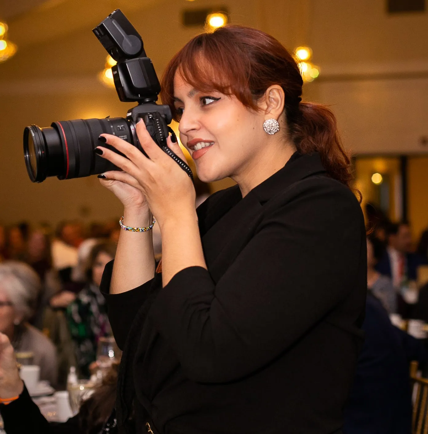 taking photos at wedding by Mariana