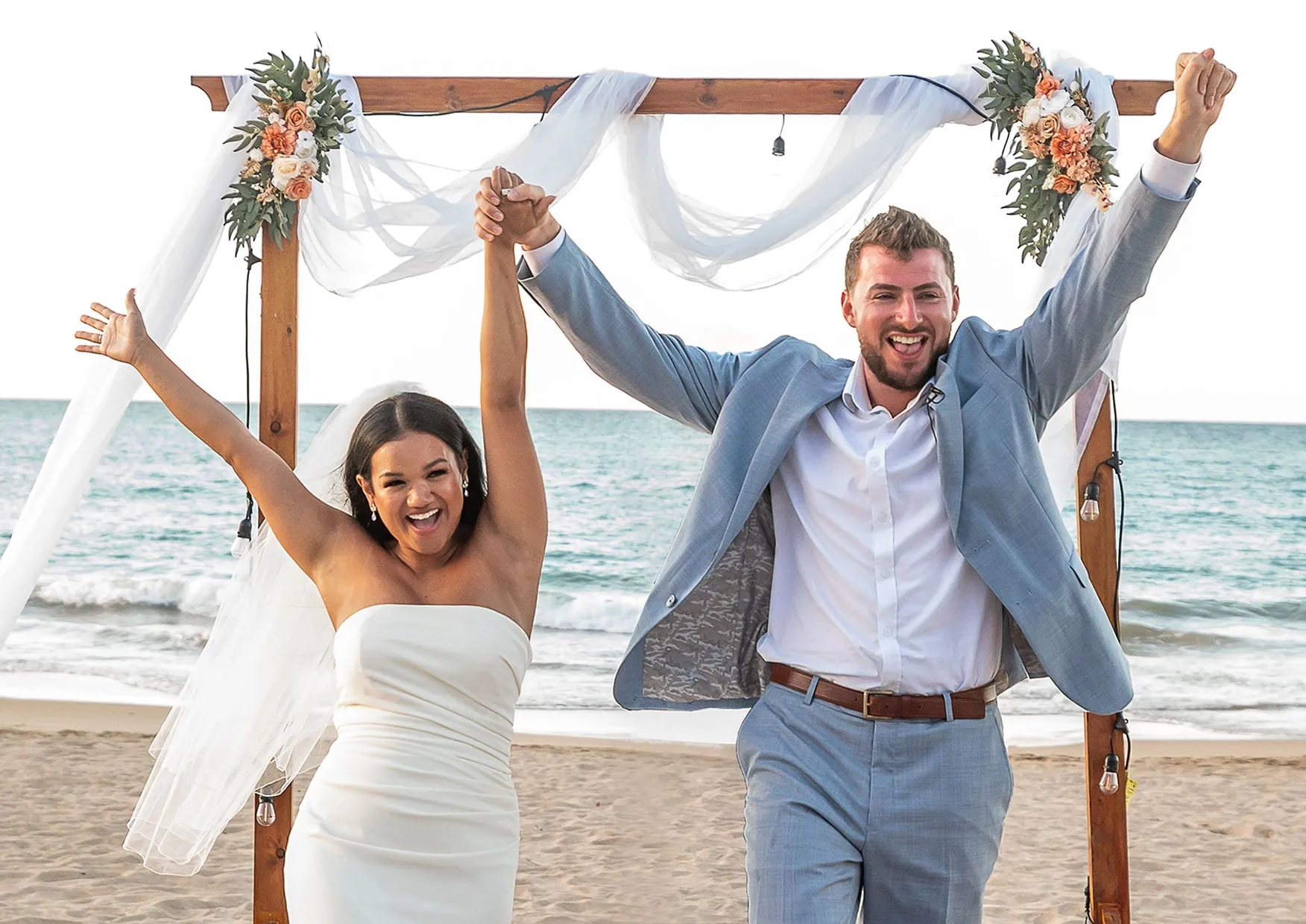 Just married happy couple walking down the aisle in Puerto Rico.