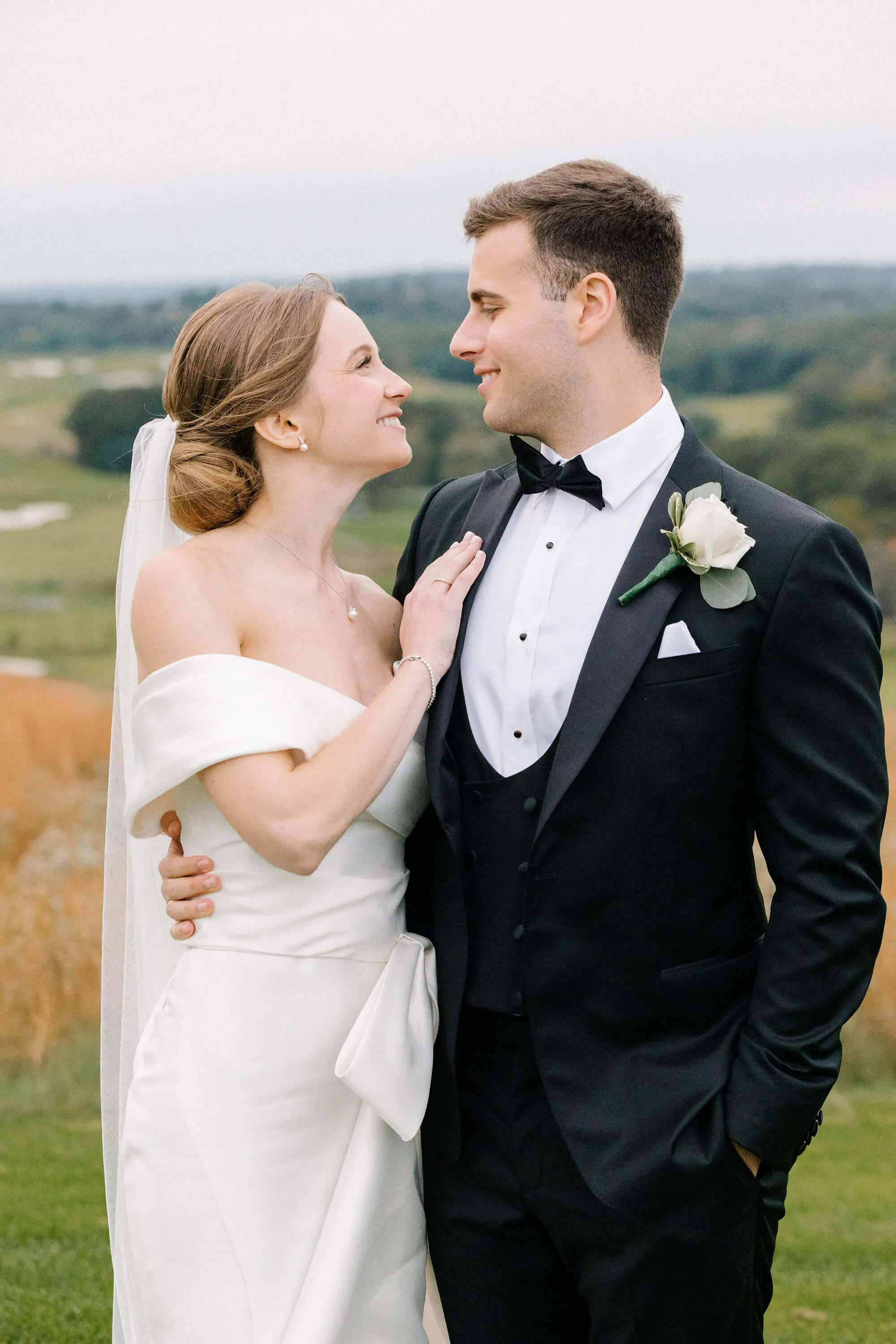 Bride and groom on wedding day looking into each others eyes