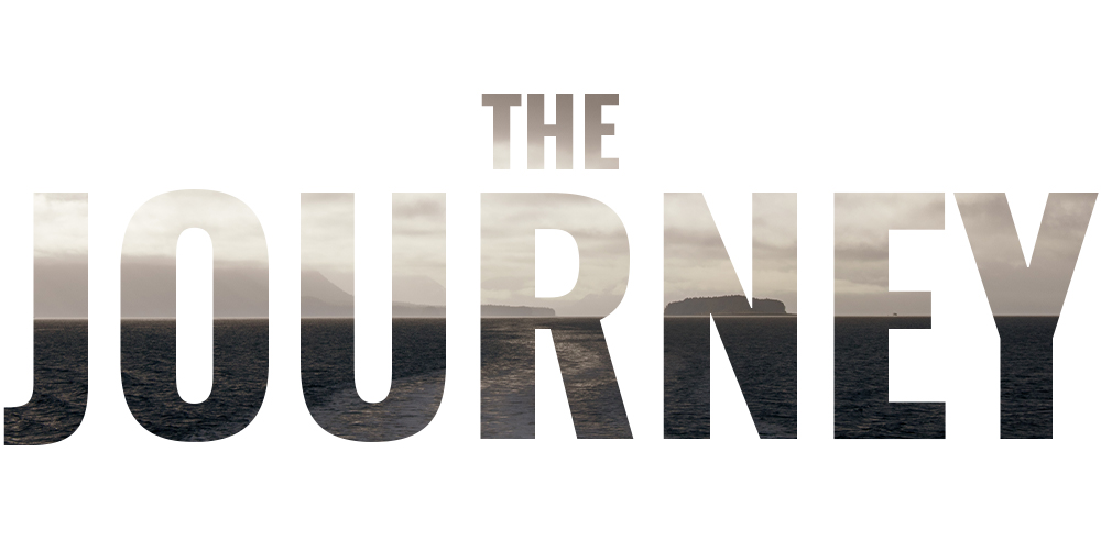 Text reading 'THE JOURNEY' filled with an image of a calm sea, distant mountains, and an island under a cloudy sky.