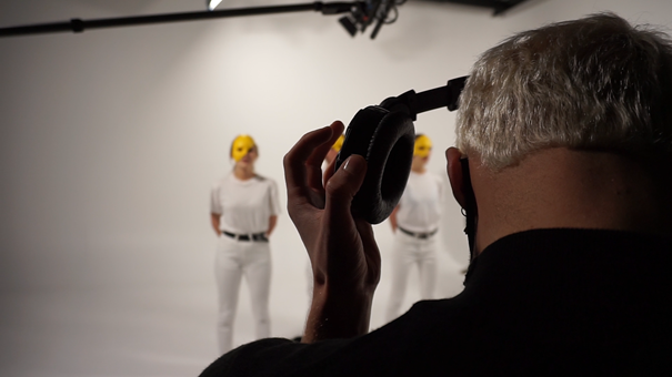 on set, director in the foreground