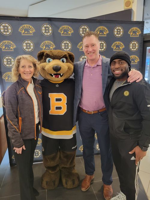 Jae and Bruins coworkers with Blades the Bruins mascot