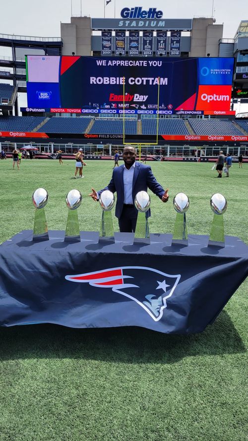 Jae posing with the Lombardi trophies at Gillette Stadium