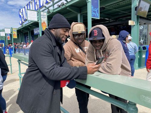 Jae talking with fans during a Red Sox game
