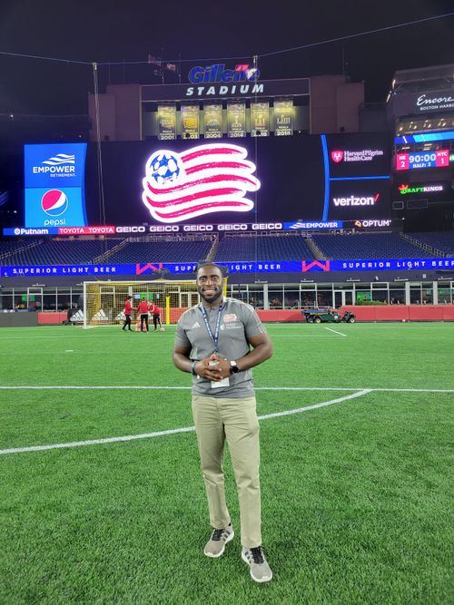 Jae posing before a Revs game on the field