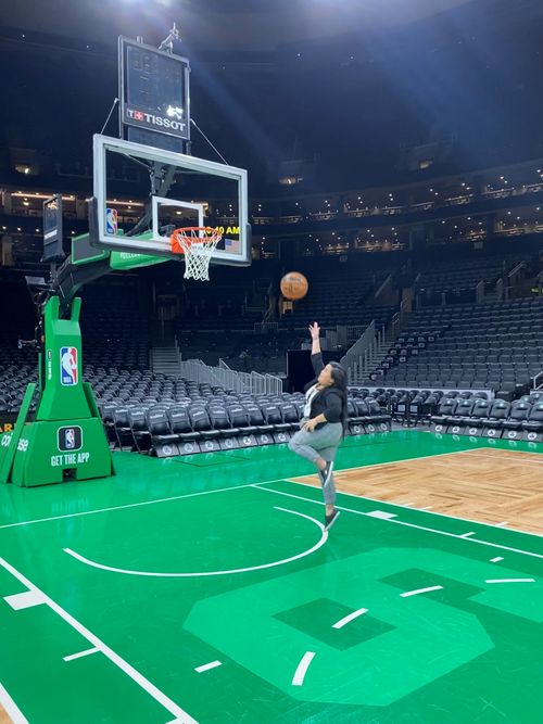 Kaity doing a layup on the Celtics court
