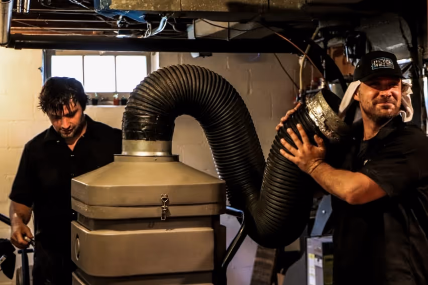 Reed and team hooking up HEPA vacuum