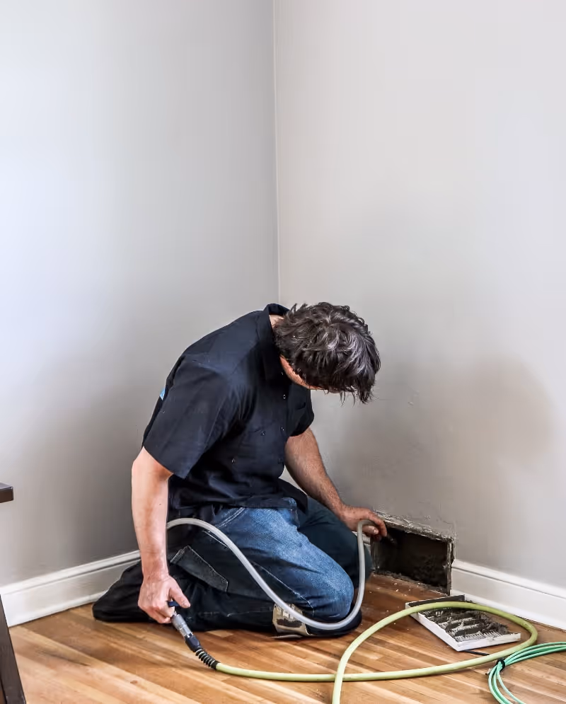 Reed cleaning out duct work in house