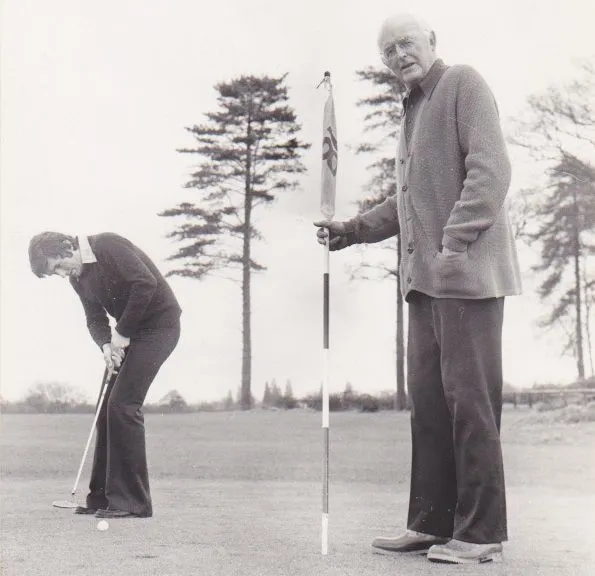 Michael and Matthew Rogerson playing golf