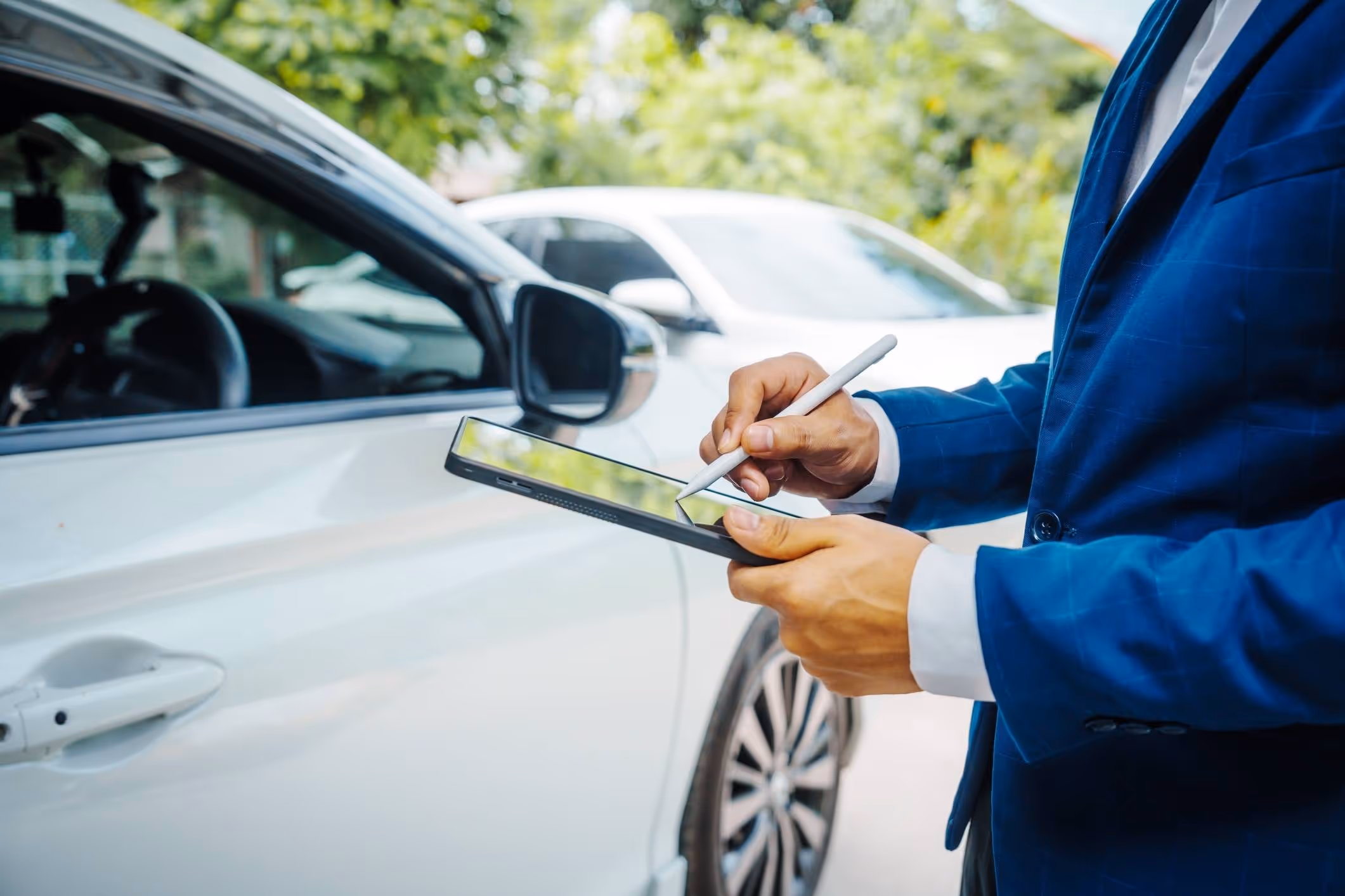 Insurance agent reviewing documents after a crash, reflecting the role of a Kissimmee car accident attorney.
