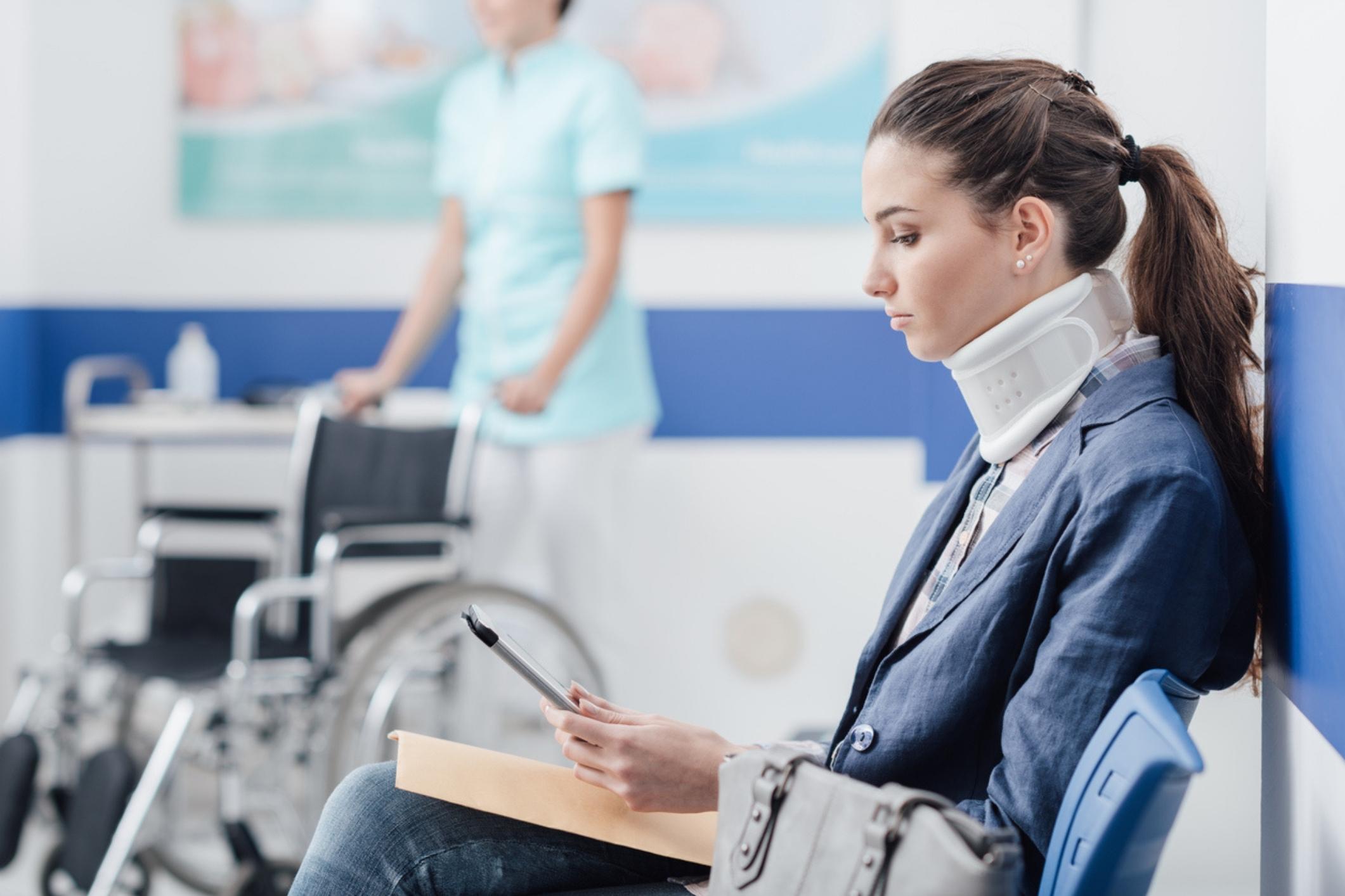 Injured woman in a hospital waiting room, reflecting the need for a Deerfield Beach personal injury lawyer.