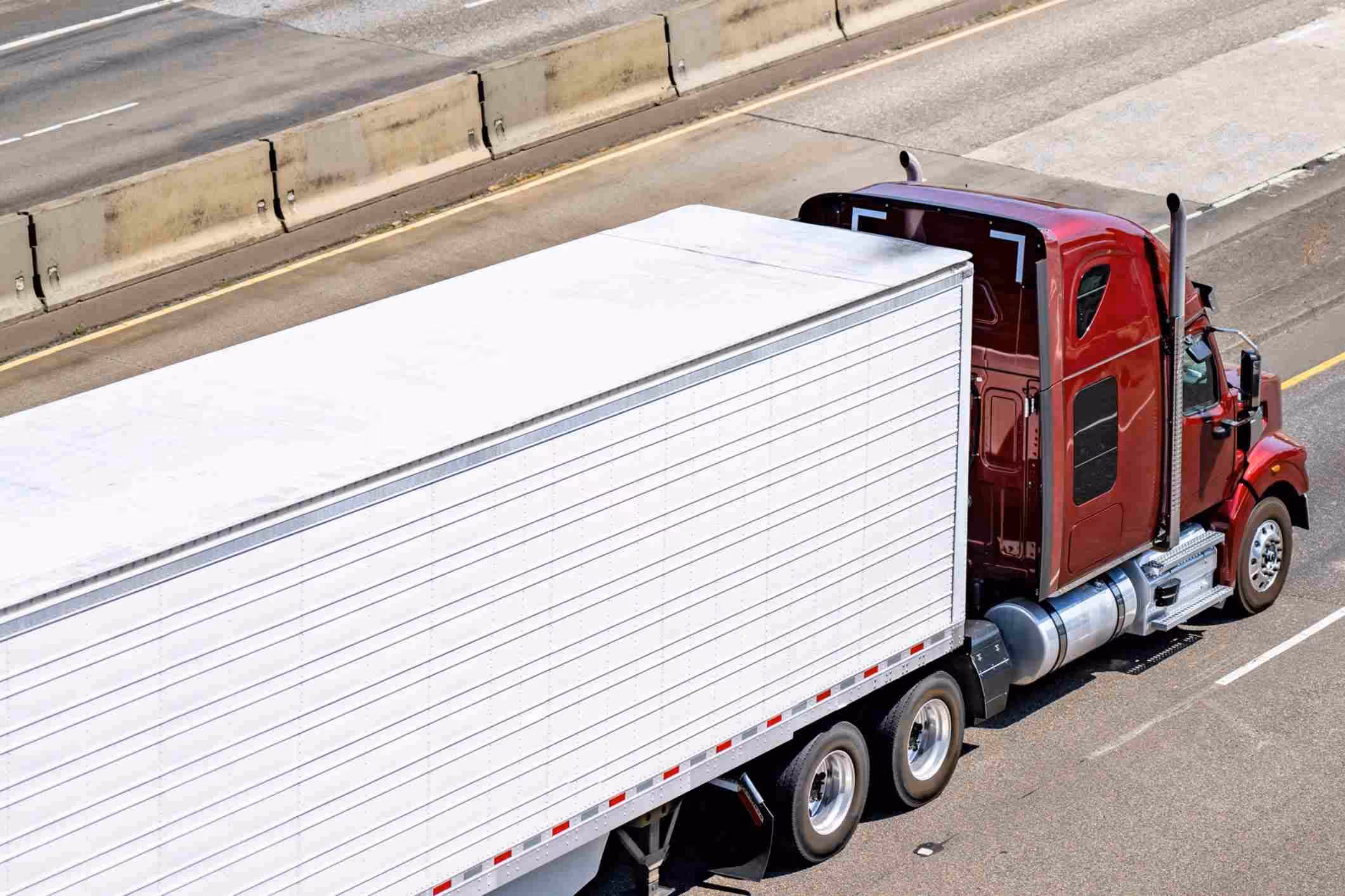 Cargo semi-truck traveling on Florida road, illustrating Altamonte Springs truck accident attorney services.