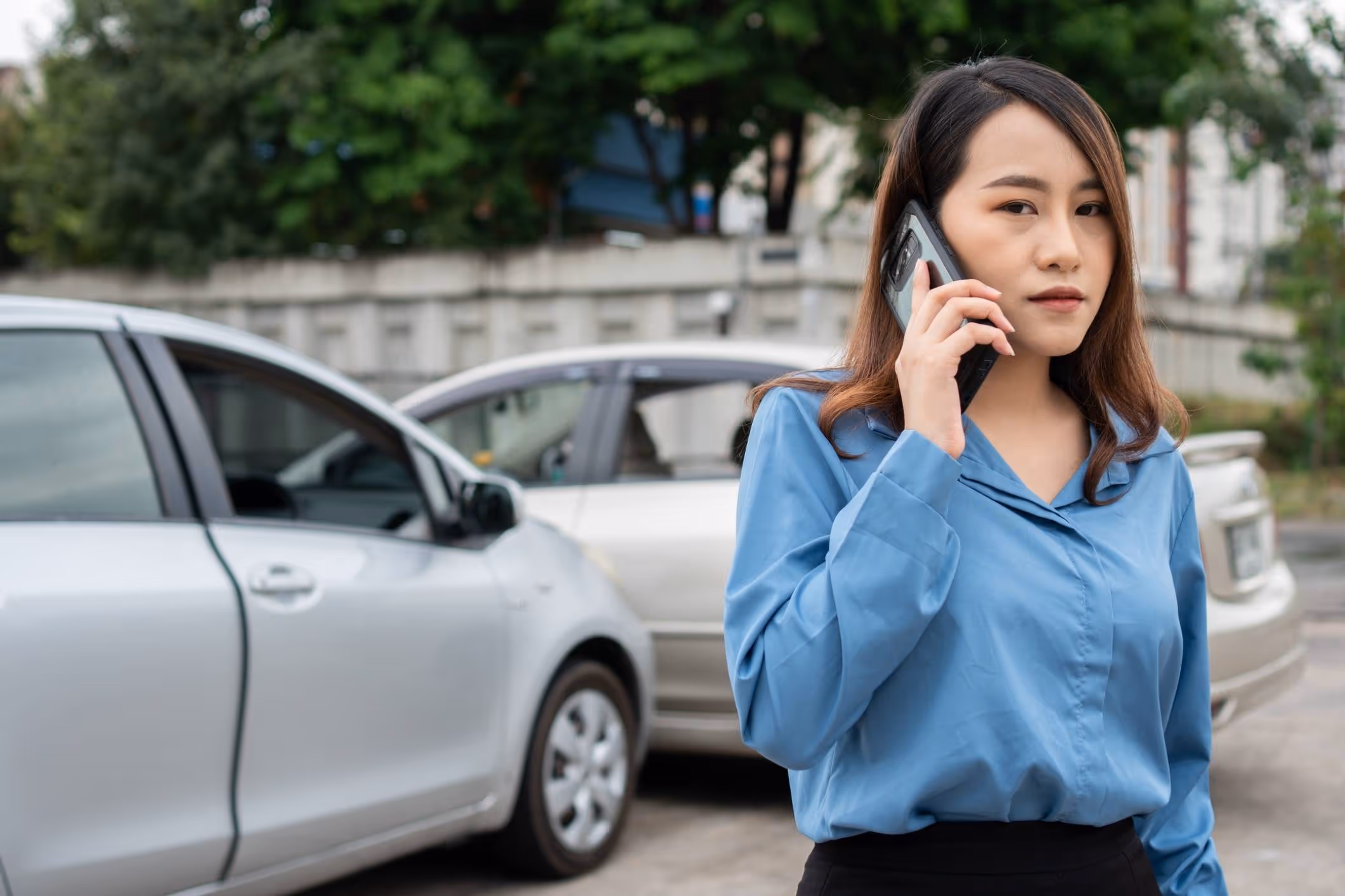 Woman calling after collision, illustrating Coral Springs car accident attorney services.