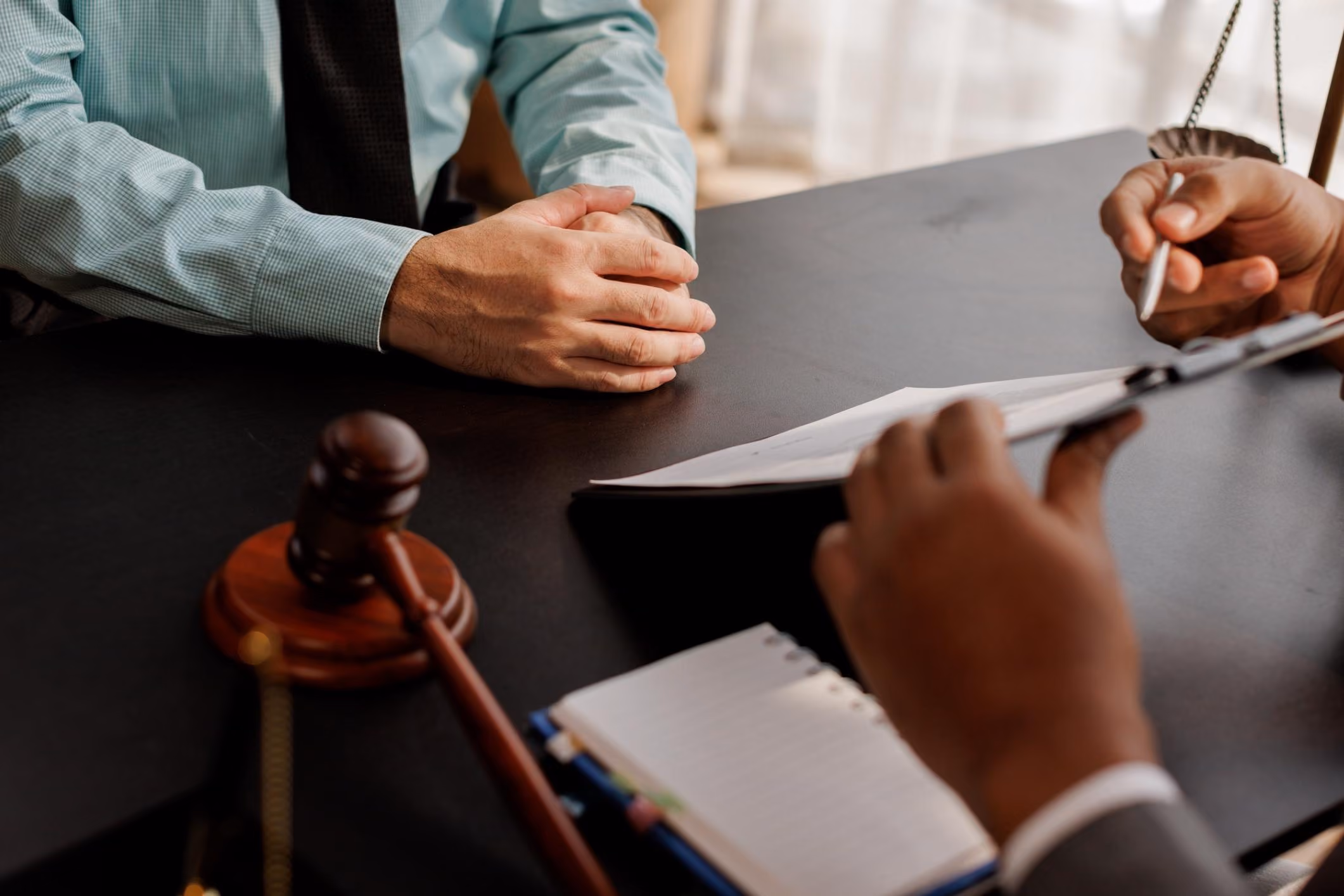 A person discussing sovereign immunity with their lawyer.