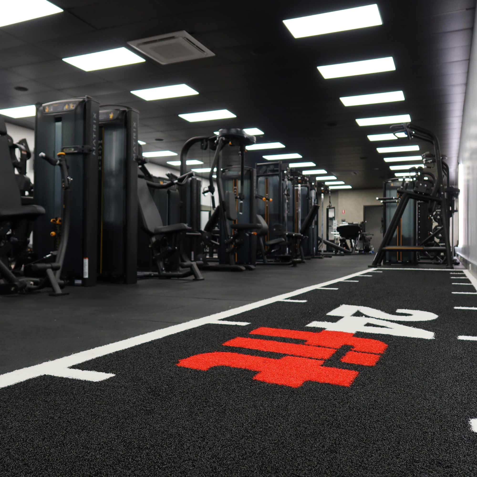 Personal Trainer stretching in gym class